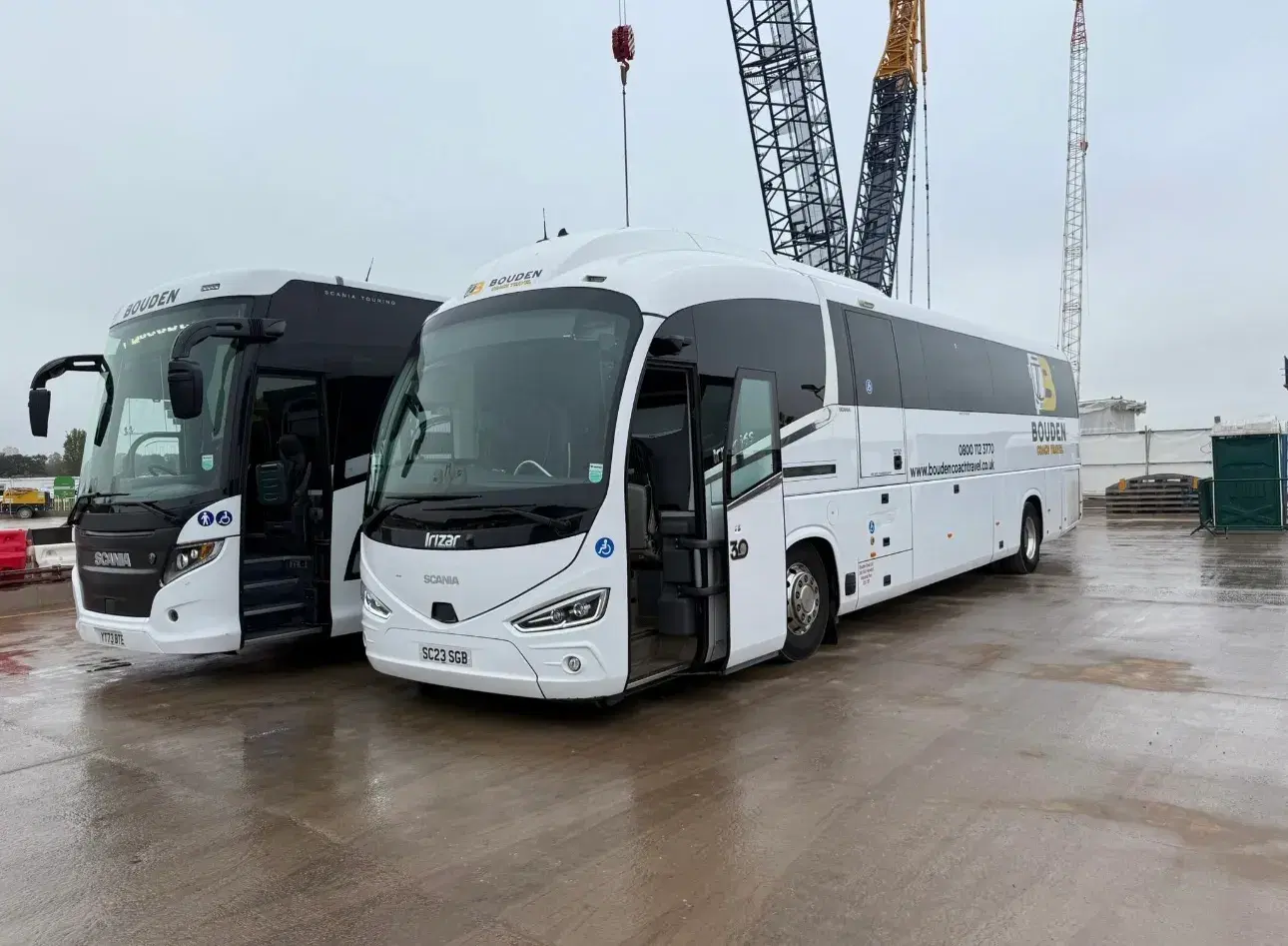 Two Bouden Coach Travel coaches parked on a Birmingham construction site while carrying a workforce group